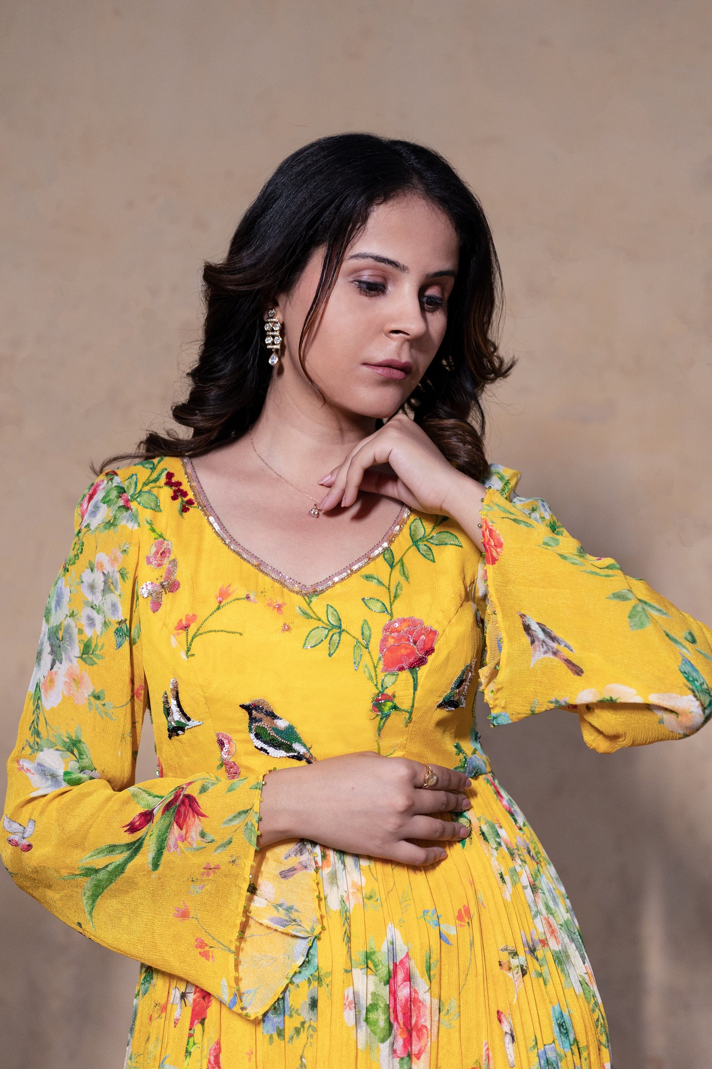 Yellow Anarkali suit with Organza dupatta.